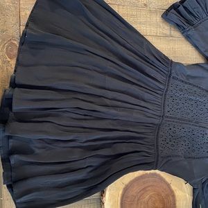 the flowers on the top are holes but it can be worn with something under.